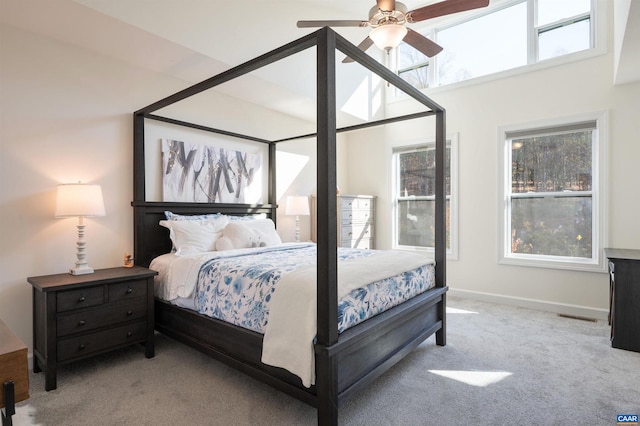 bedroom featuring light colored carpet and ceiling fan