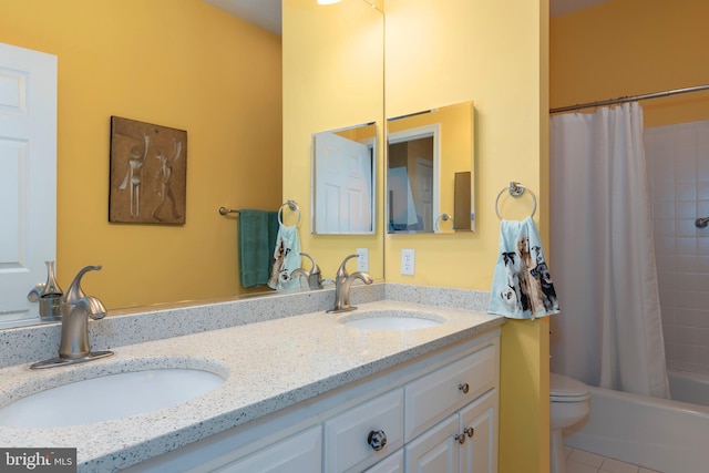 full bathroom with tile patterned floors, vanity, toilet, and shower / tub combo with curtain