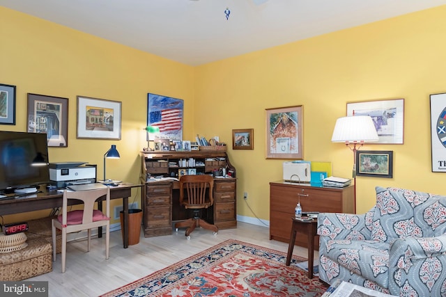 office with light hardwood / wood-style flooring