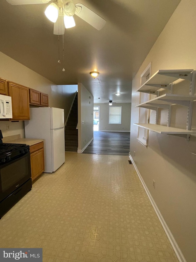 kitchen with ceiling fan, white appliances, and light wood-type flooring