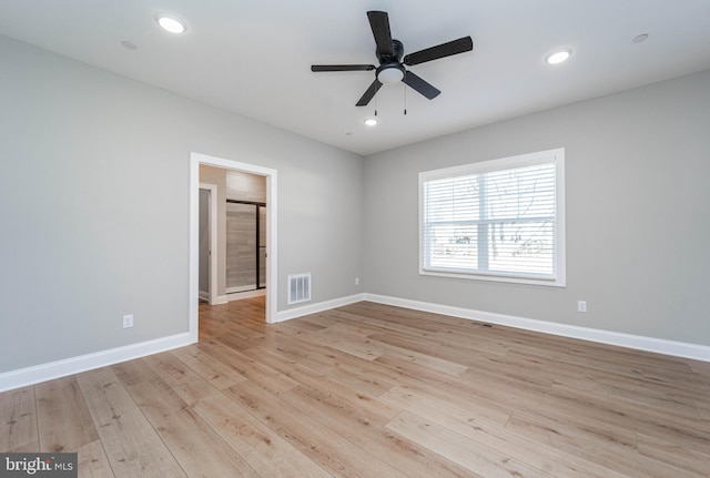 unfurnished room featuring ceiling fan and light hardwood / wood-style floors