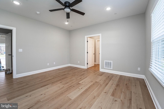 unfurnished room with ceiling fan and light hardwood / wood-style flooring