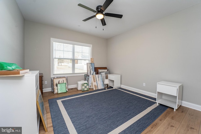 bedroom featuring dark hardwood / wood-style floors and ceiling fan