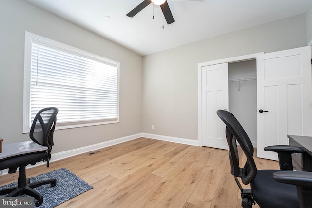 office area with ceiling fan and light hardwood / wood-style flooring