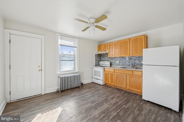 kitchen with radiator heating unit, sink, dark hardwood / wood-style floors, white appliances, and decorative backsplash