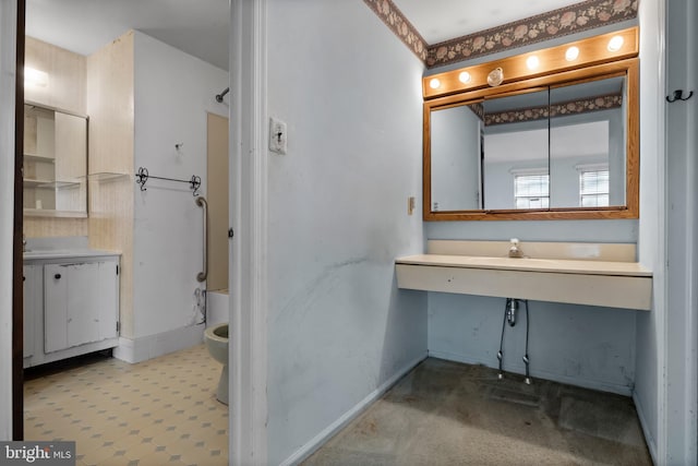 bathroom featuring toilet and sink