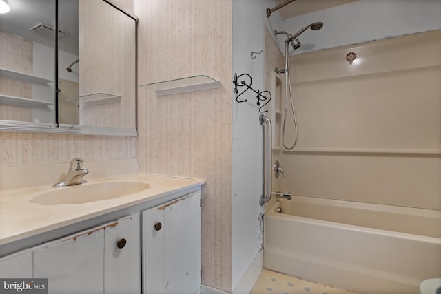 bathroom with vanity, tile patterned floors, and shower / washtub combination