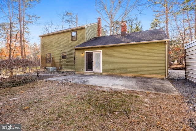 back of house with central AC unit and a patio area