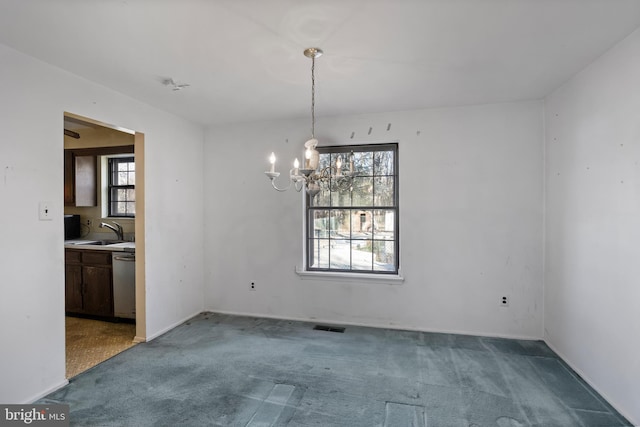 unfurnished dining area with sink, carpet, and a notable chandelier