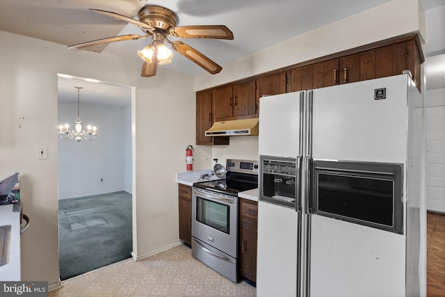 kitchen featuring stainless steel electric range, white fridge with ice dispenser, ceiling fan with notable chandelier, and hanging light fixtures