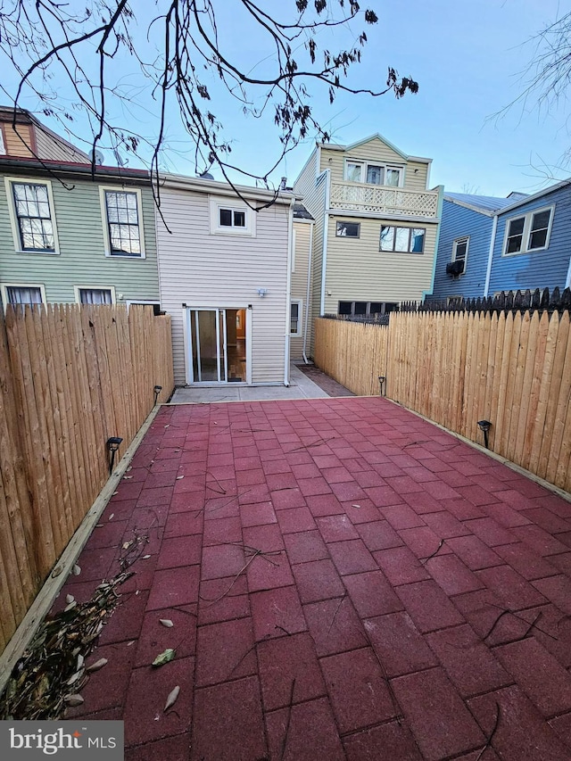 back of property with a patio area