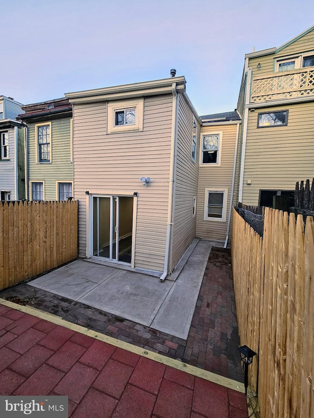 rear view of house featuring a patio