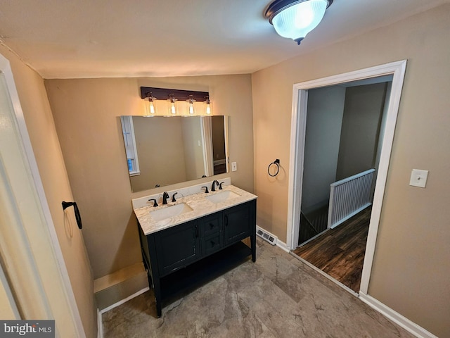 bathroom featuring vanity and hardwood / wood-style flooring