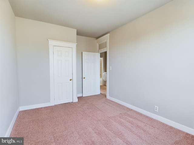 unfurnished bedroom featuring carpet