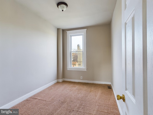 empty room featuring carpet flooring