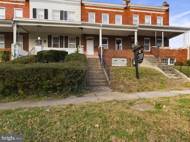 view of property with covered porch