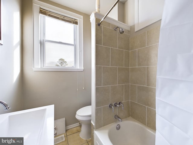 full bathroom with tile patterned flooring, shower / tub combo with curtain, toilet, and sink