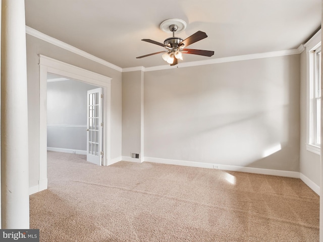 unfurnished room with carpet flooring, ceiling fan, french doors, and ornamental molding