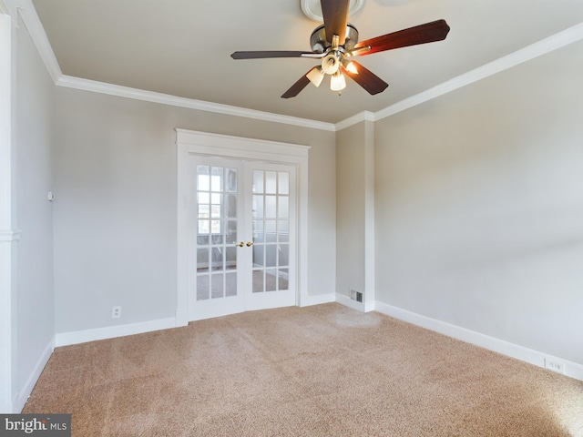 unfurnished room with carpet flooring, french doors, ceiling fan, and ornamental molding