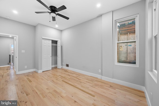 unfurnished bedroom with light hardwood / wood-style flooring and ceiling fan