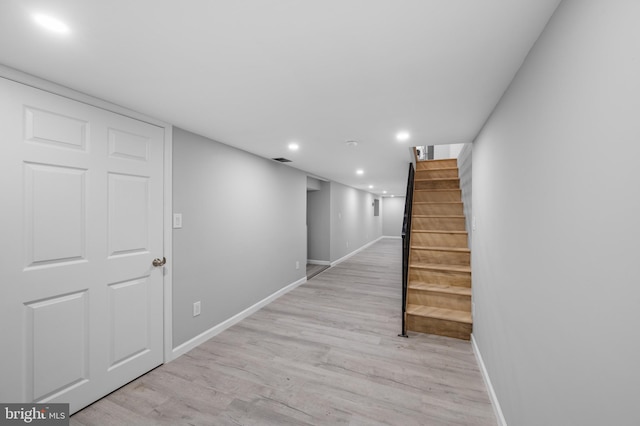 hall with light hardwood / wood-style flooring