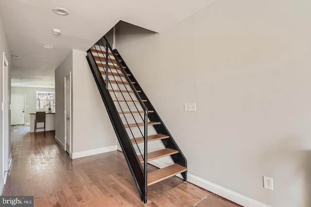 stairway featuring hardwood / wood-style flooring