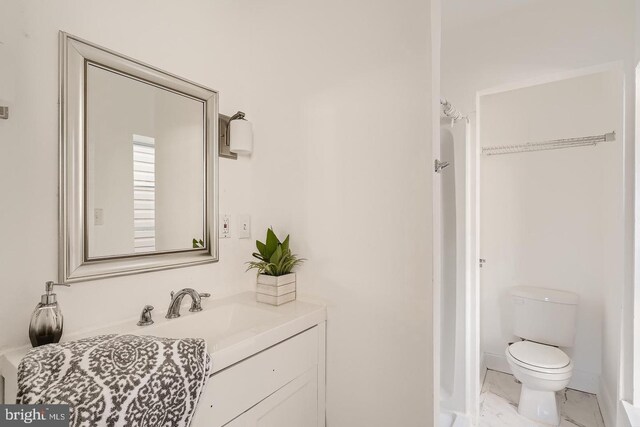 bathroom with vanity and toilet