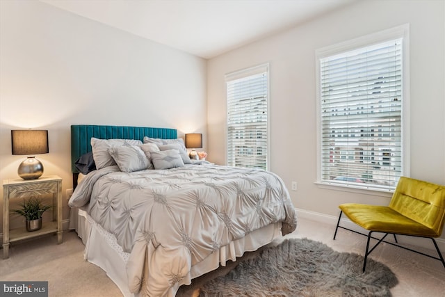 bedroom with light carpet