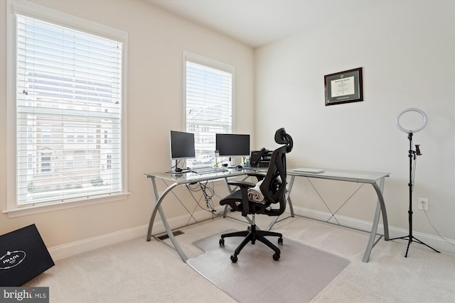 office area with light colored carpet