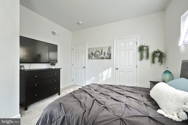 bedroom with light carpet