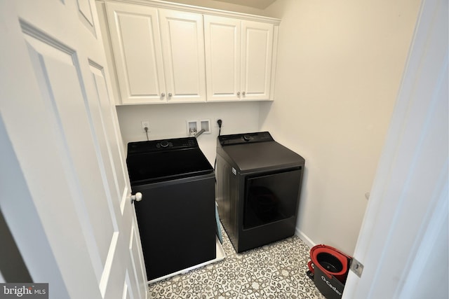 laundry area featuring cabinets and independent washer and dryer