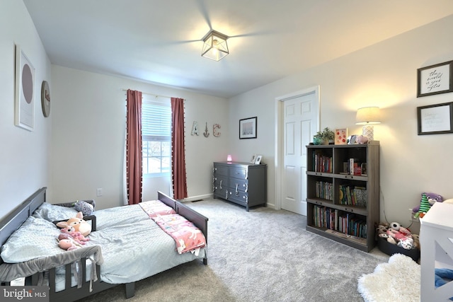 bedroom featuring light colored carpet