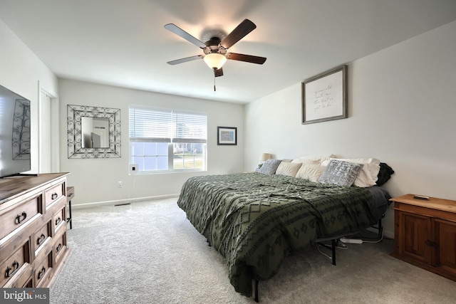 bedroom featuring ceiling fan and light colored carpet