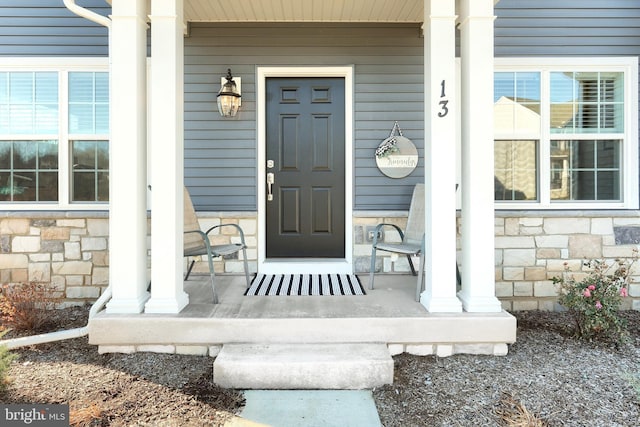 doorway to property with covered porch