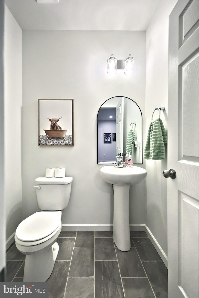 bathroom featuring toilet