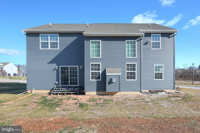 back of house with a yard