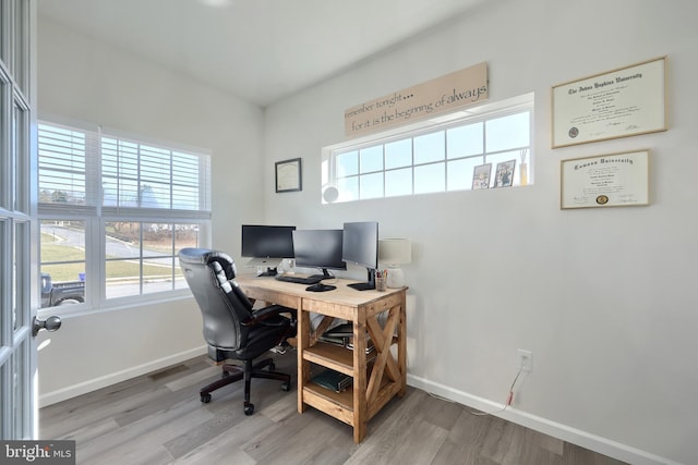 home office with hardwood / wood-style floors