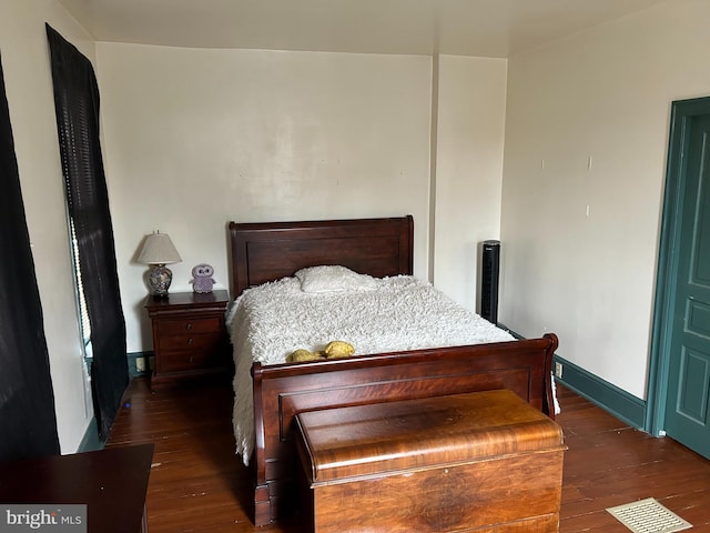 bedroom featuring dark hardwood / wood-style floors