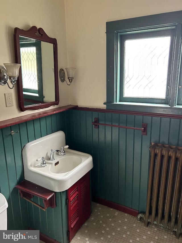 bathroom with vanity and radiator heating unit