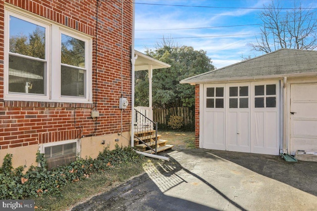 view of side of home featuring a garage