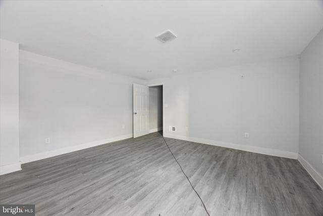 unfurnished room with dark hardwood / wood-style floors