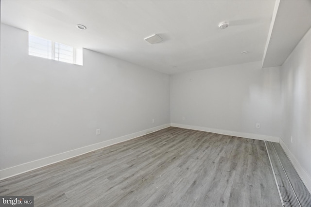 spare room with light wood-type flooring