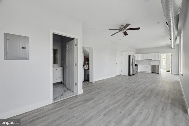 unfurnished living room featuring ceiling fan, light wood-type flooring, electric panel, and water heater