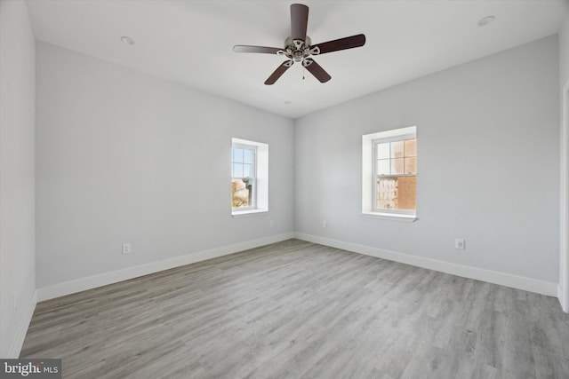 unfurnished room featuring light hardwood / wood-style floors and ceiling fan