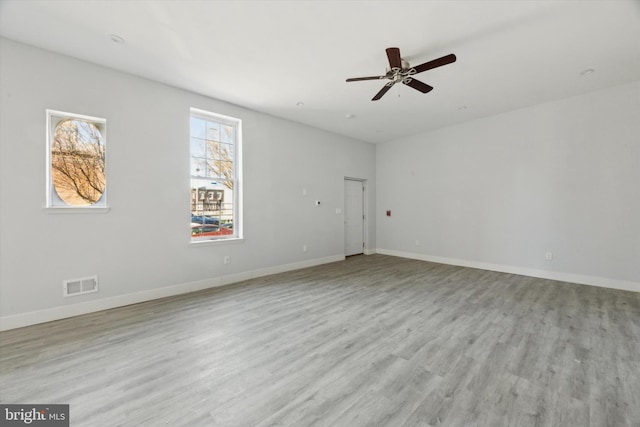 unfurnished room with ceiling fan and light hardwood / wood-style floors