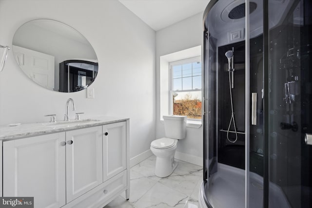 bathroom with vanity, toilet, and walk in shower