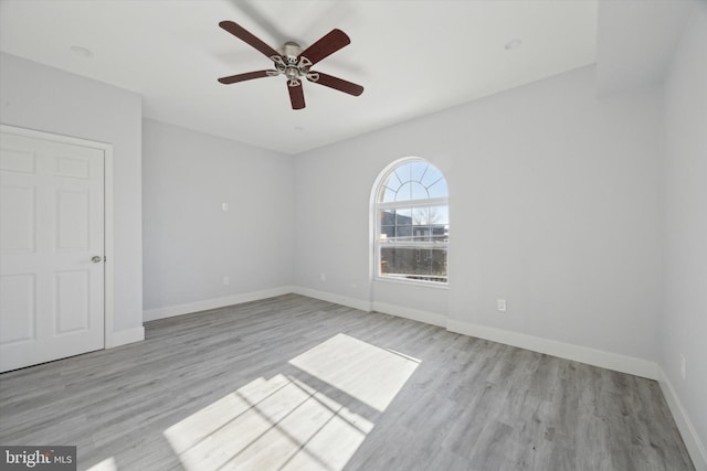 unfurnished room featuring ceiling fan and light hardwood / wood-style floors