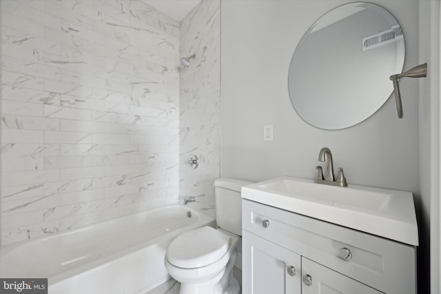 full bathroom featuring vanity, toilet, and tiled shower / bath