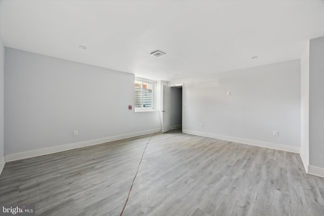 empty room with light hardwood / wood-style floors