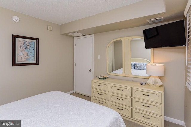 bedroom featuring a textured ceiling